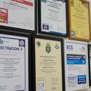 Display of electrician qualifications including NVQ and City & Guilds certificates
