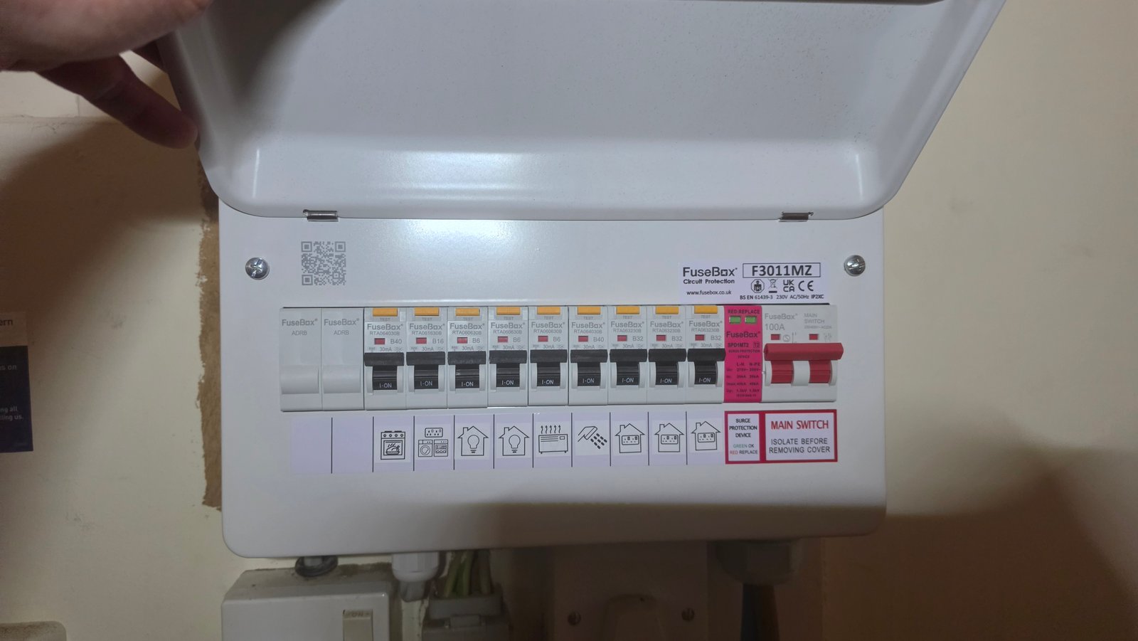 Electrician opening a FuseBox consumer unit during an installation in a Kincorth home