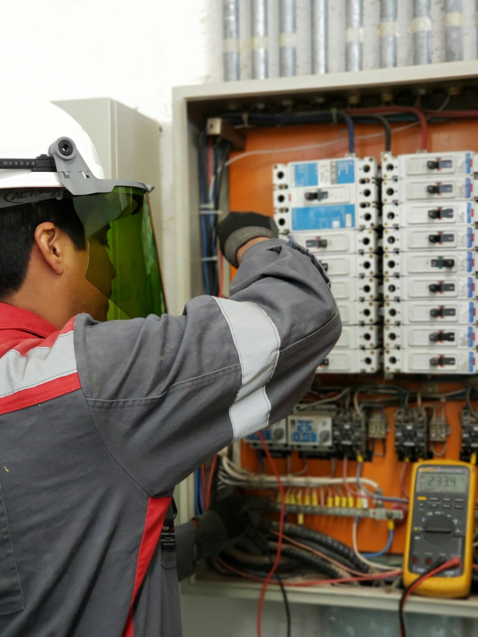 Electrician ppe testing fuse board in Westhill