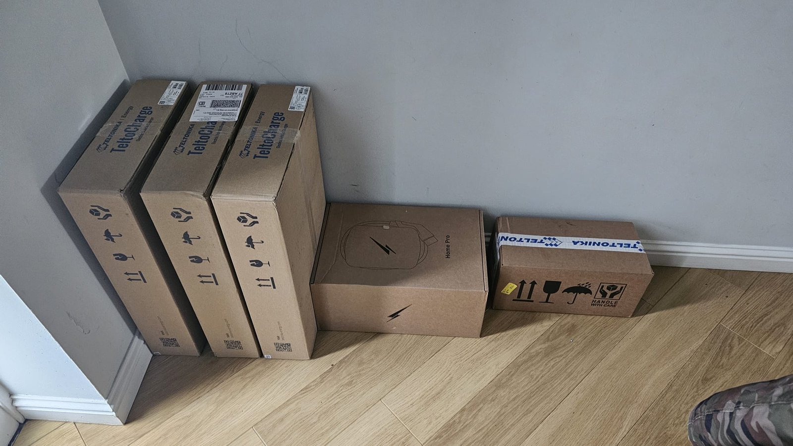 OZEV approved EV chargers ready to install in Aberdeen. TeltoCharge and Ohme Home Pro units delivered for upcoming jobs