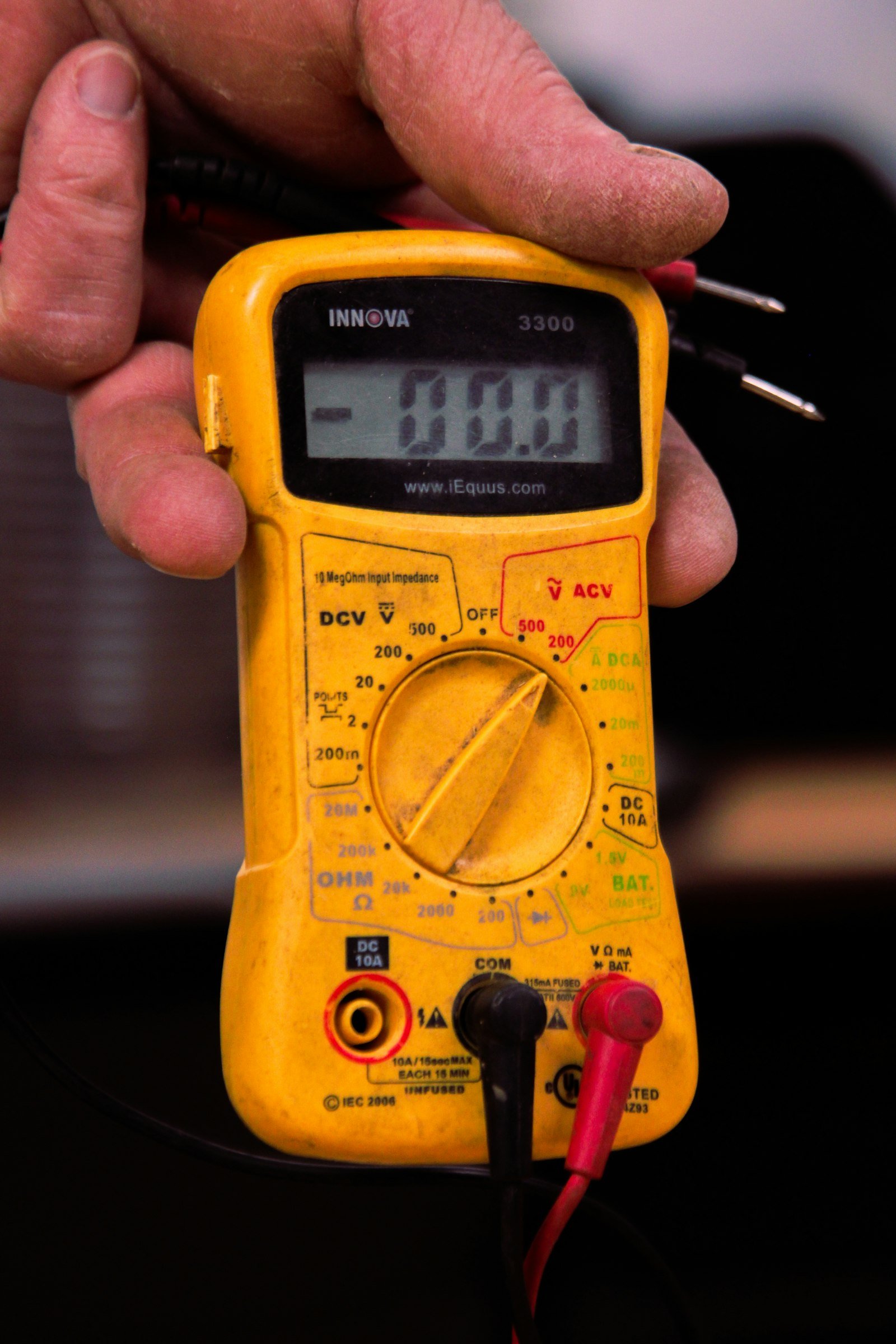 Hand holding multimeter in Maryculter