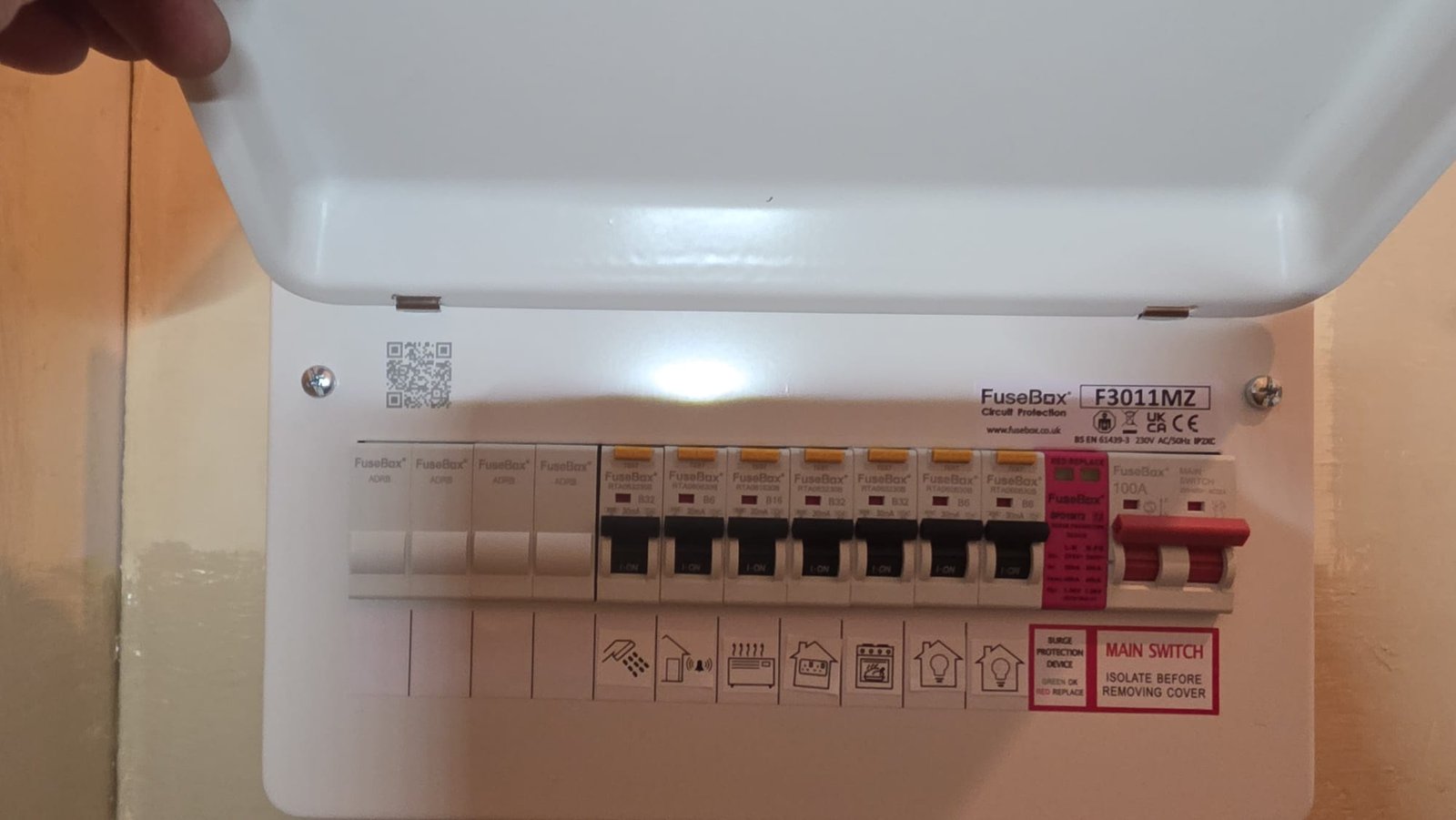 New LED ceiling bulkhead light installation in an Aberdeen hallway. Energy-efficient replacement