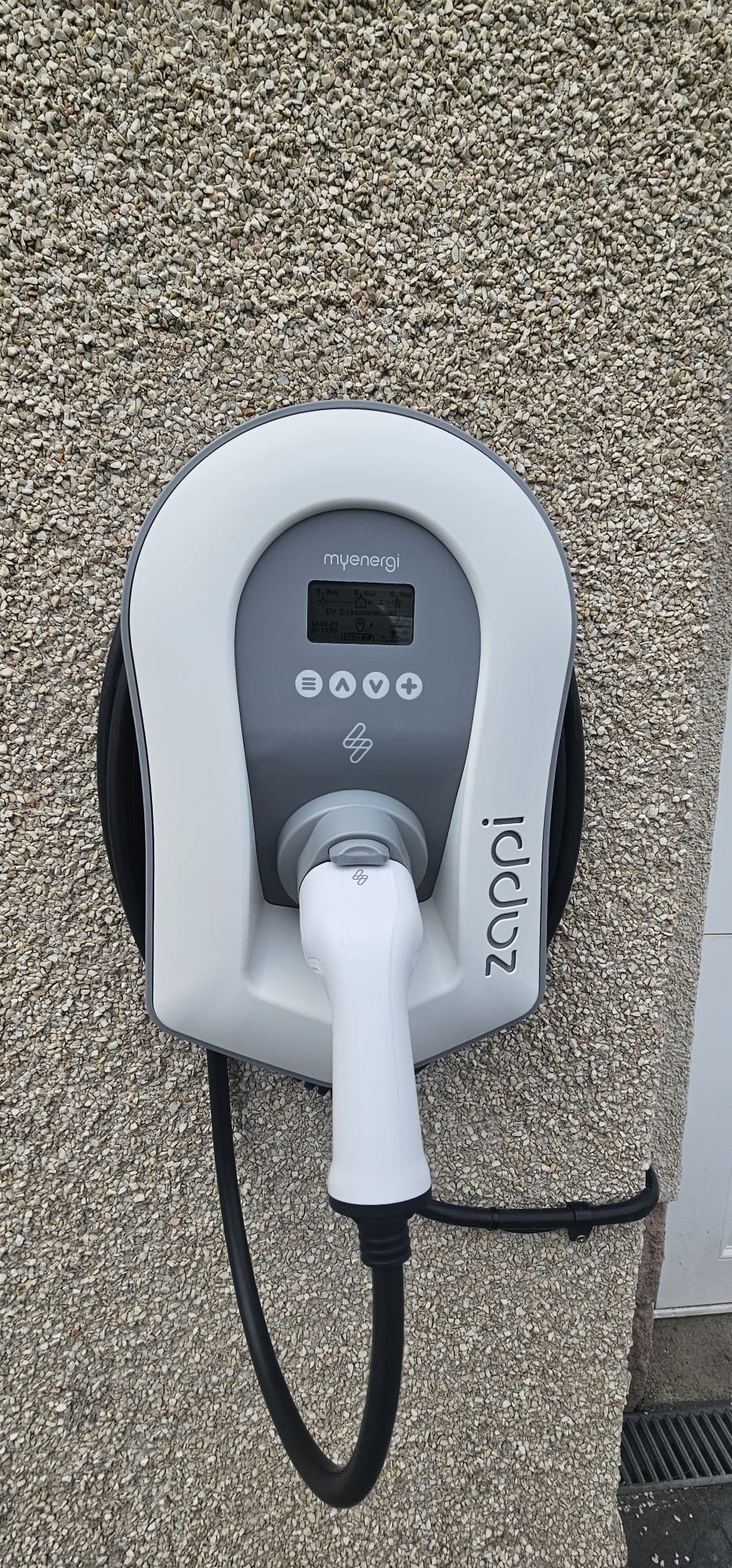myenergi Zappi V2 EV charger installed at an Aberdeen home on a pebble-dashed wall. Solar-compatible OZEV approved unit