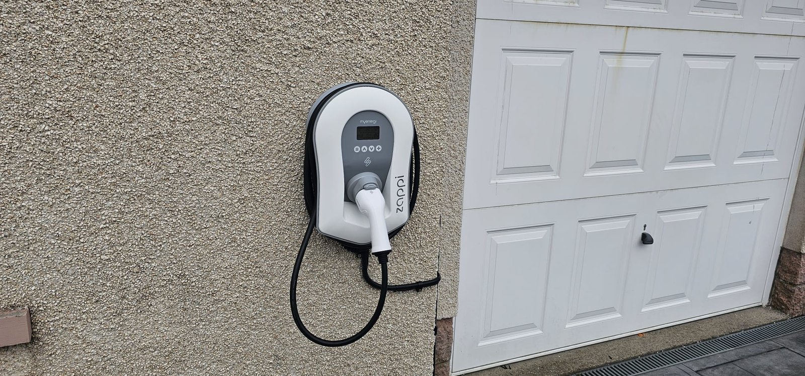 myenergi Zappi EV charger installation at an Aberdeenshire home, fitted next to the garage door