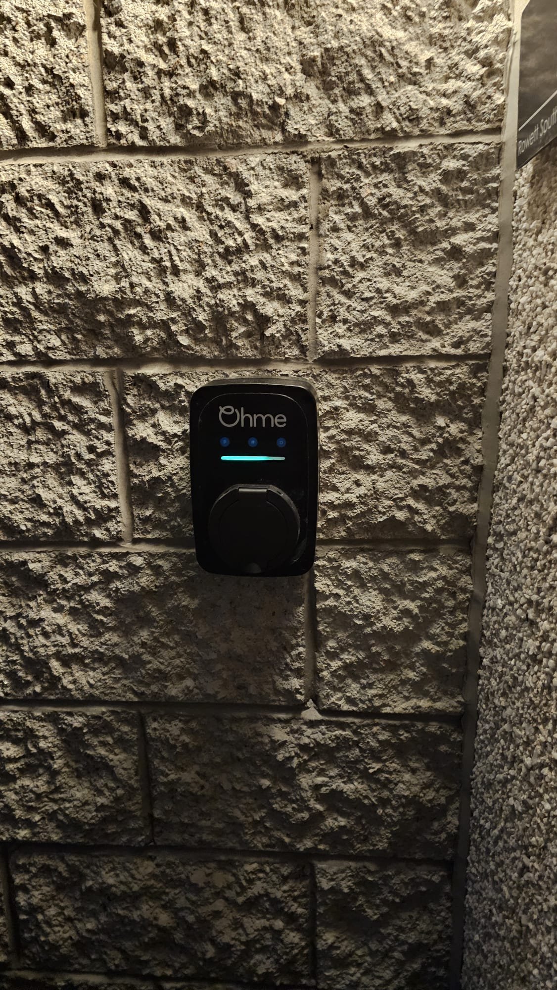 Close-up of the Ohme home EV charger LED status indicator after installation in Aberdeen