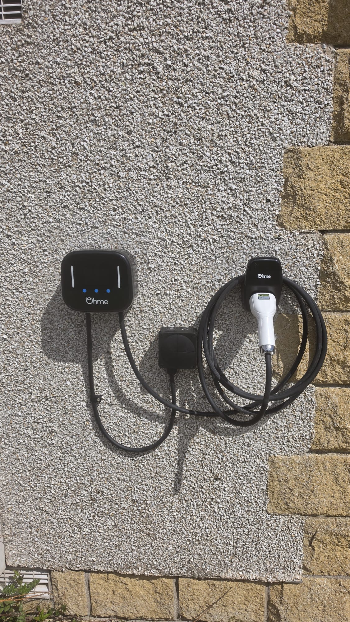 EV charger sited discreetly on a sandstone Mannofield house