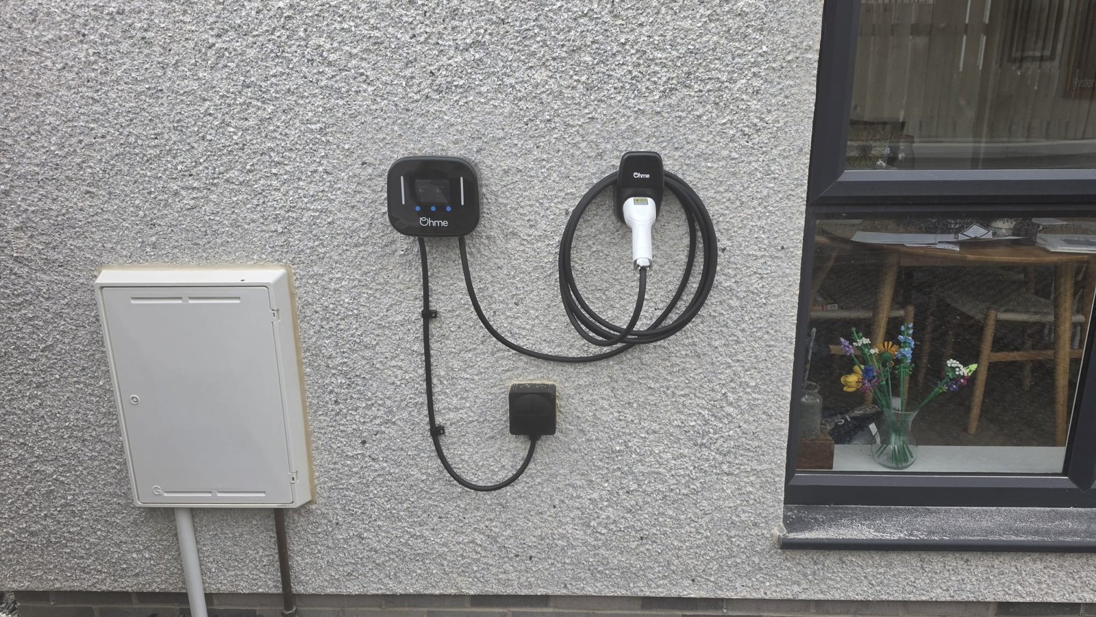 Ohme Home Pro EV charger and isolator installed on a Mannofield home