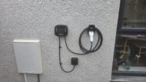 Ohme EV charger installed on outdoor render wall in Aberdeenshire by Faithful Spark Electricians
