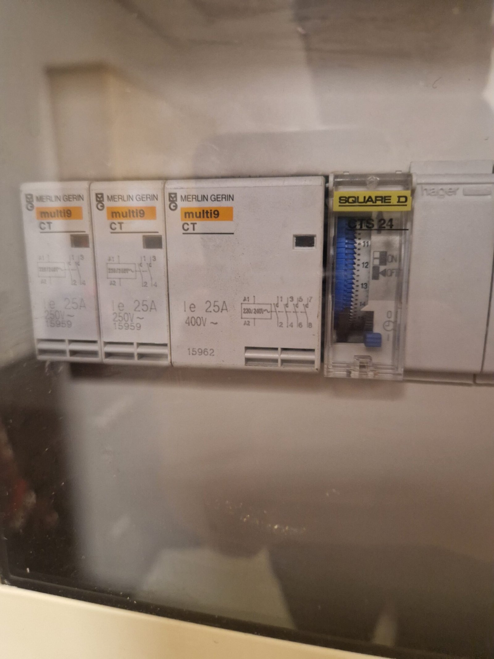 Old consumer unit with contactors and a time switch found in an older Aberdeenshire property