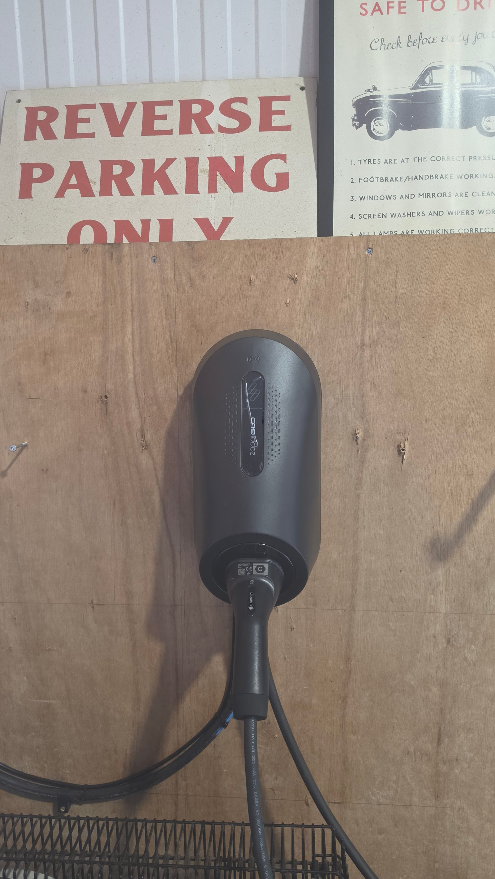 myenergi Zappi EV charger connector plugged into a car at a Northfield home