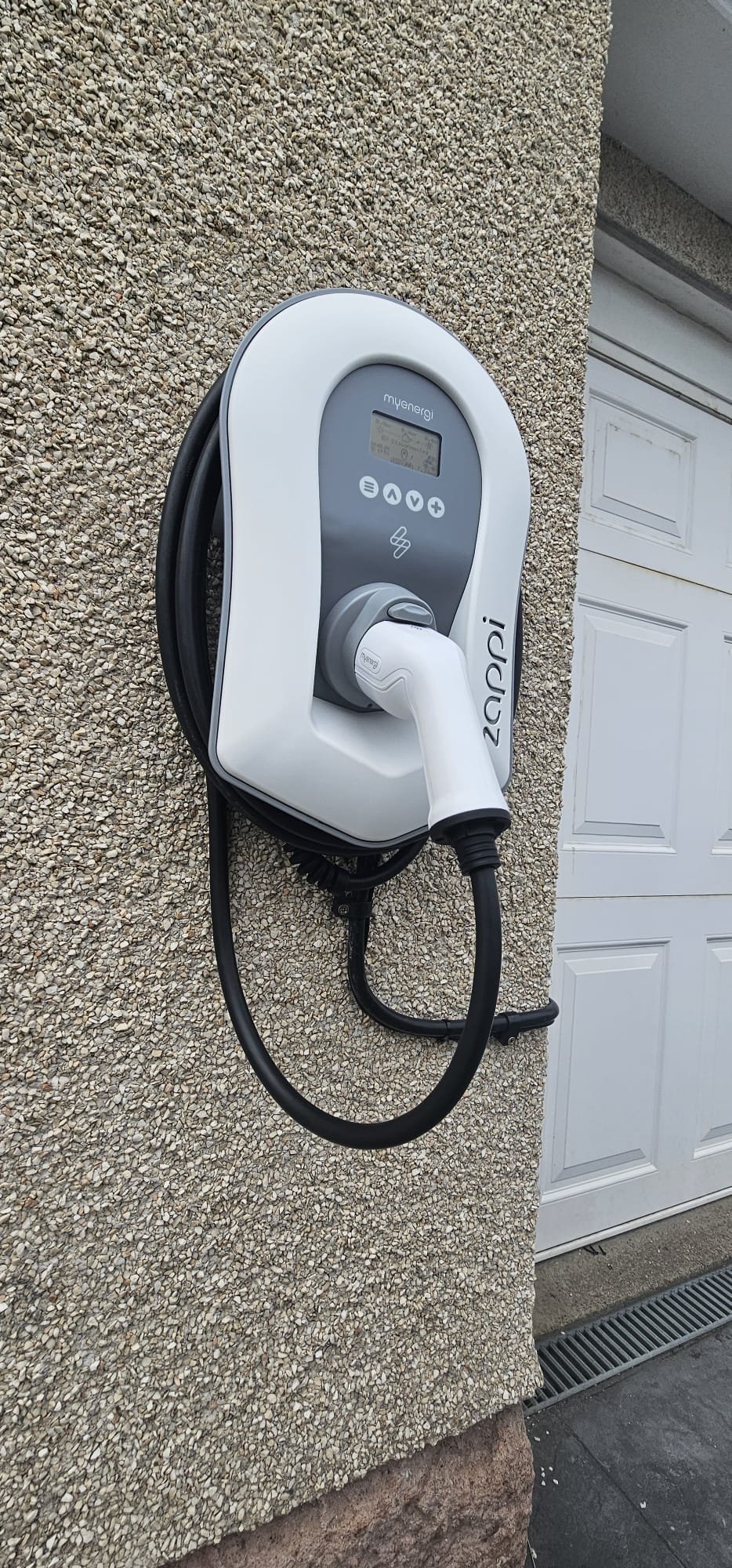 Zappi myenergi EV charger installed beside a garage door in Bucksburn