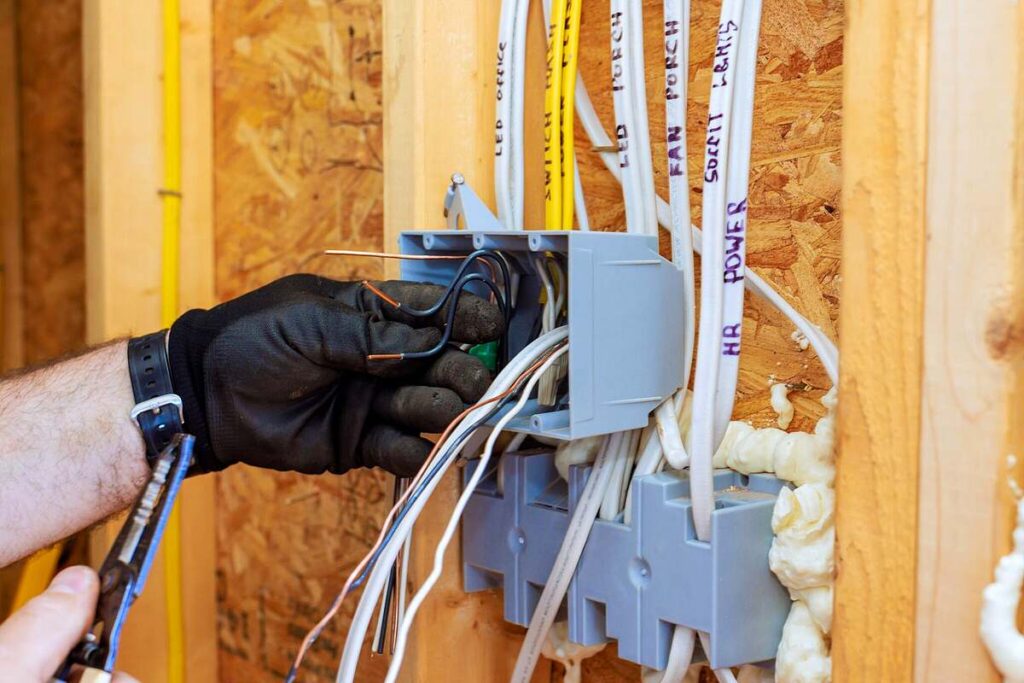 House rewire first fix wiring in Aberdeen — cables being routed through floor void by Faithful Spark Electricians