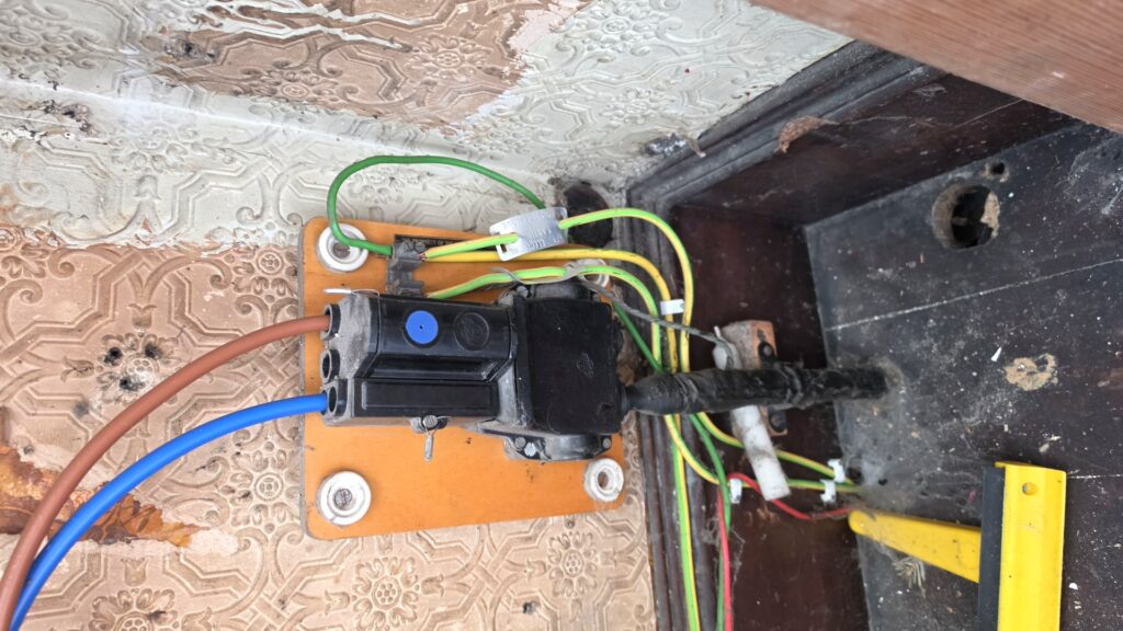 Exposed old wiring and junction box found in older Fraserburgh property Scotland