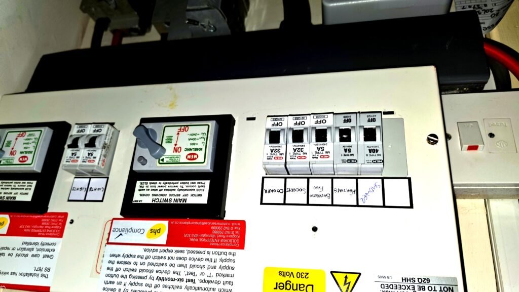 Old MEM consumer unit found during EICR inspection in an Aberdeen flat — typical of 1970s and 1980s tenement conversions