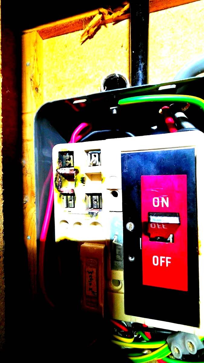 Burnt and damaged consumer unit found during EICR inspection in Aberdeen — a common C1 finding requiring immediate replacement