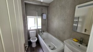 Bathroom electrical installation in Fraserburgh — electric shower, heated towel rail and extractor fan fitted to BS 7671 Zone requirements by Faithful Spark Electricians