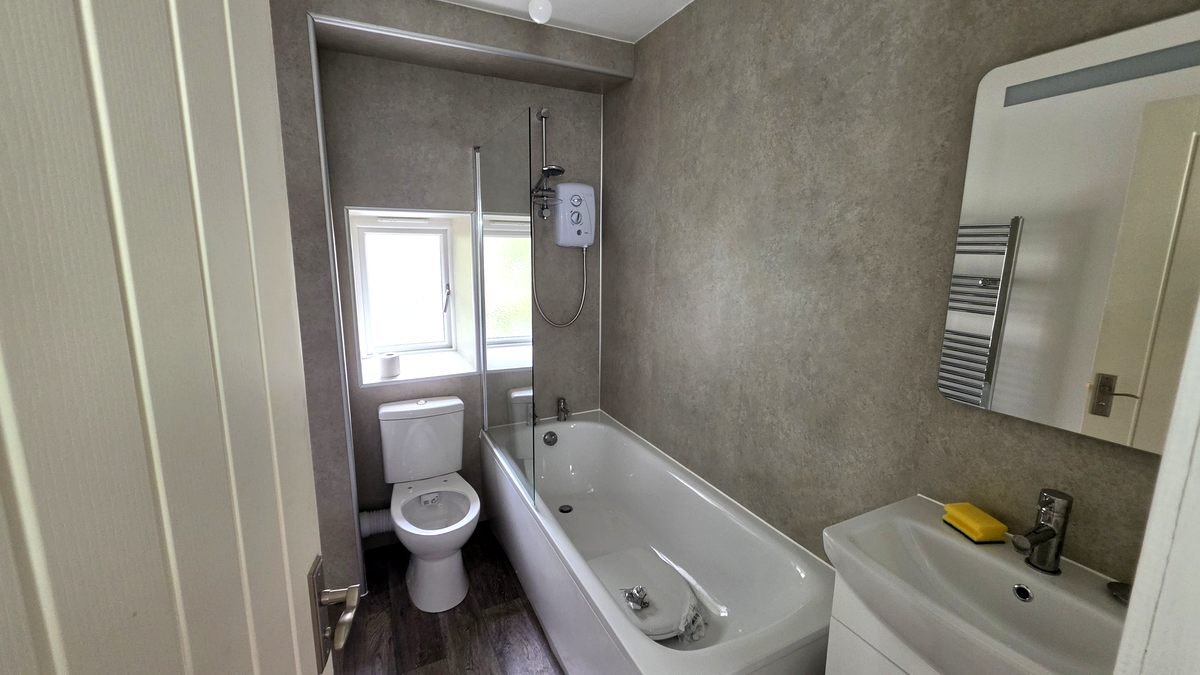 Bathroom electrical installation in Fraserburgh — electric shower, heated towel rail and extractor fan fitted to BS 7671 Zone requirements by Faithful Spark Electricians