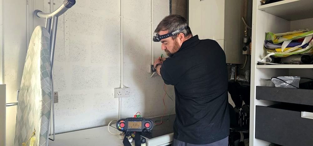 Socket being tested with a multifunction tester during an Aberdeenshire EICR