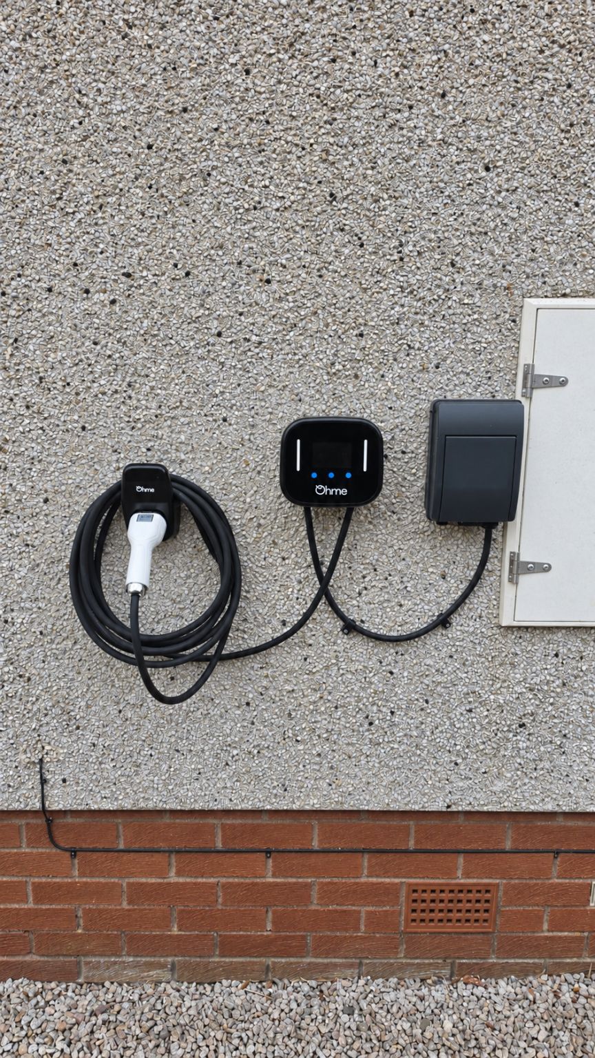 Ohme Home Pro EV charger installed by Faithful Spark Electricians on the exterior wall of an Aberdeen home, with a dedicated EV consumer unit and cable holster
