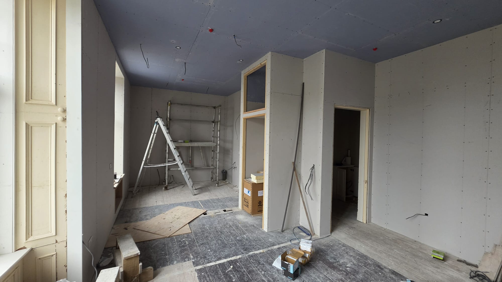 Boarded room in Fraserburgh with recessed downlights in the ceiling and cable drops ready for accessories